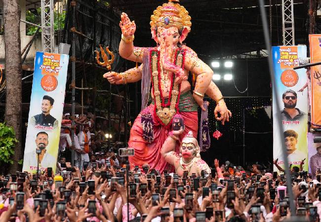 With dhol-tasha and gulal, Mumbai gives rain-soaked farewell to 'Bappa'